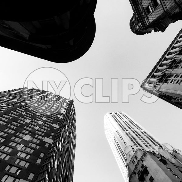 upward angle of tall towering skyscrapers - buildings from street view looking up in Manhattan
