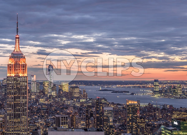 famous landmarks - Empire State Building and Freedom Tower in breathtaking Manhattan cityscape from high view at sunset in early evening NYC