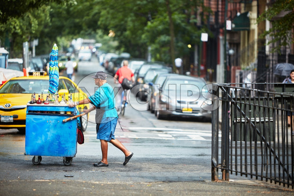 man pushing icy cart in summer New York City