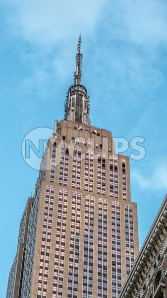 Empire State Building on bright blue sky during day