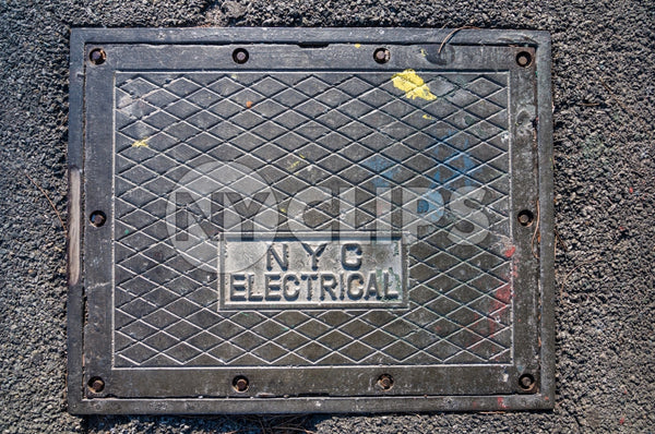 NYC electrical square cover on concrete