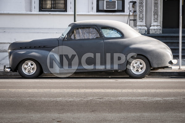 classic sedan from the 40s parked on Park Avenue - old fashioned car in Manhattan