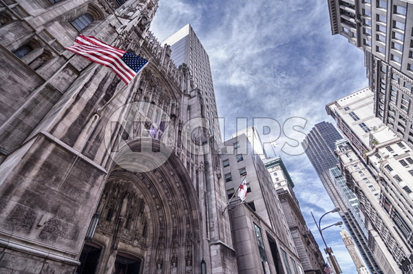 Saint Paul's Cathedral with American flag in Midtown Manhattan on sunny day in HDR