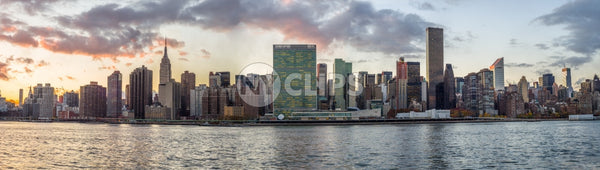 Manhattan skyline at sunset from across East River - super wide