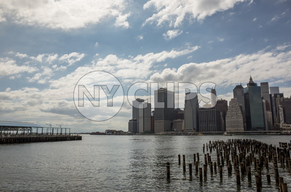 wood dowels in East River with Manhattan skyline