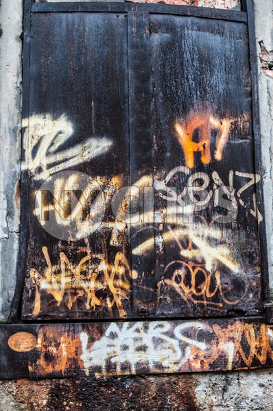 gritty graffiti and vandalism on gritty doorway