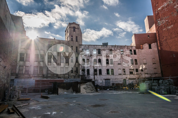 poverty stricken Harlem courtyard in Uptown Manhattan ghetto - broken down abandoned building