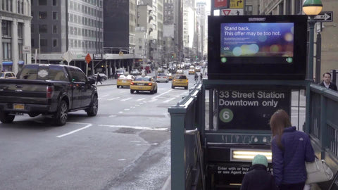mother and child walking down subway station entrance staircase on Park Ave with cars driving in 1080 HD in NYC