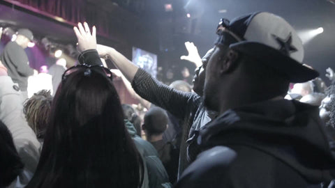hip hop show - fans in crowd - hat backwards bobbing head to music