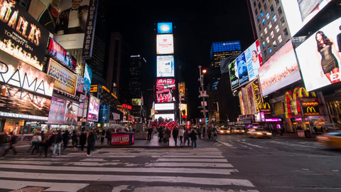 center of Times Square in the Big Apple with bright lights and billboards - 4K timelapse at night in NYC