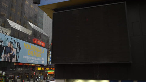 high street view passing Times Square street during the day