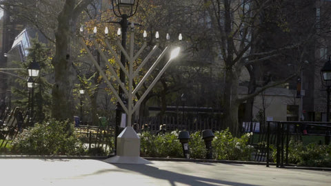 Big Menorah on holidays in Washington Square Park on bright sunny day in NYC