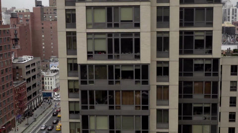 aerial view over east side of Manhattan with busy traffic in street below, cars and taxicabs driving in 1080 HD NYC