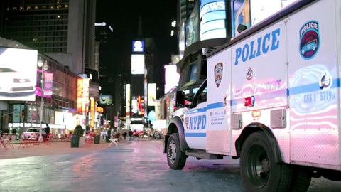 NYPD police truck parked in Times Square at night