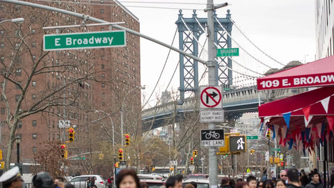 Manhattan Bridge view from East Broadway in Chinatown Little Italy in Downtown on cloudy fall day