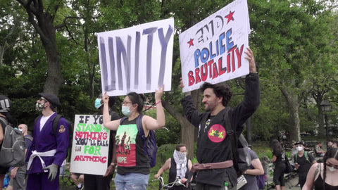 Unity and End Police Brutality sign at BLM rally in Washington Square Park NYC