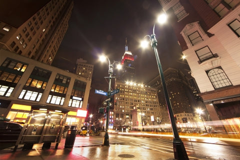 Herald Square with Empire State Building at night in Manhattan New York City NYC