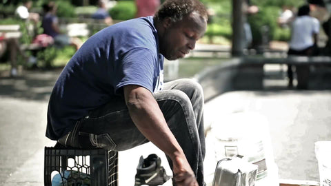 talented drummer banging pots and pans in Washington Square Park - musician performing on hot summer day in NYC