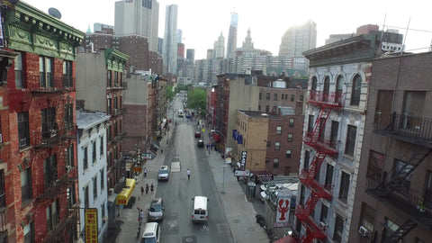 aerial moving over street through Chinatown NYC