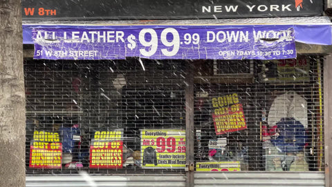 leather store going out of business sale 99 dollars deals gated up snowing winter NYC
