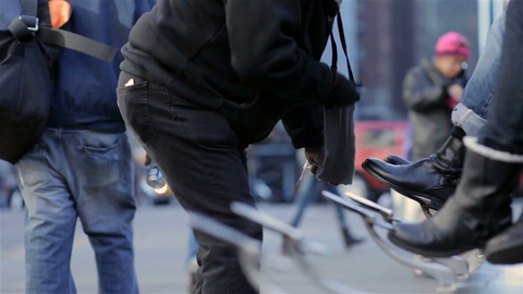 shoeshine in Manhattan during day - man shining shoes in New York City cold winter