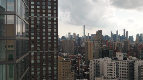 aerial passing close buildings in Manhattan cityscape - skyscrapers in New York City NYC