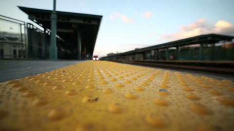 train arriving at elevated subway platform yellow line in the Bronx outside Yankee Stadium in NYC
