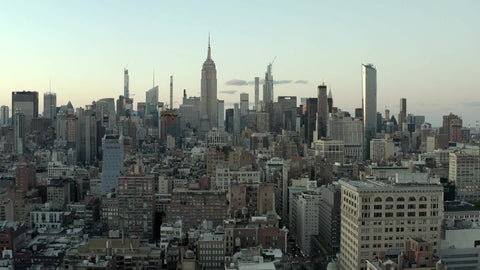Empire State Building and Manhattan cityscape buildings in New York City from aerial view