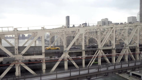Queensboro Bridge and East River water cars driving across between Queens and Manhattan in 1080 HD New York City