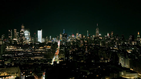 aerial buildings in cityscape lights out nightlife Manhattan at night New York City