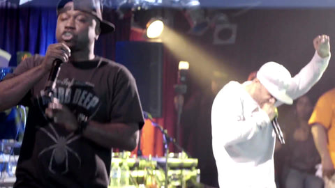 Mobb Deep rapping at show on stage with audio