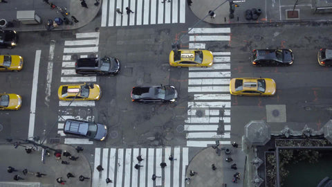 view from tall building downward angle in Midtown Manhattan busy intersection in 4K and 1080 HD in NYC