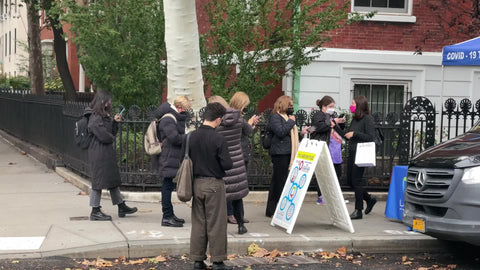 people on line waiting for free covid test on street New York City NYC