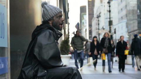 street performer drumming on buckets, drummer on cold winter day Midtown Manhattan with audio