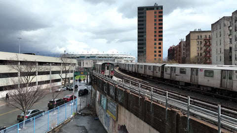 two subway trains crossing paths outside Yankee Stadium in the South Bronx NYC
