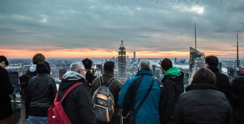 tourists appreciating view of Empire State Building in Manhattan NYC