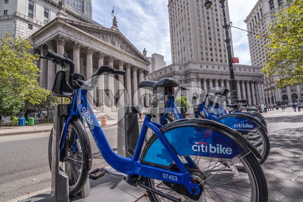 Citi Bikes parked at docking station downtown outside courthouse in Manhattan
