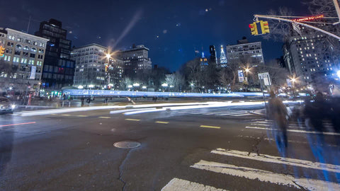 zooming out from Union Square at night in HDR - timelapse with streaks of light, motion blur cars sped up