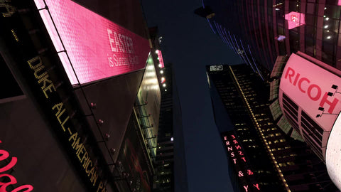 upward view of Times Square billboards and lights at night in NYC in 4K and 1080 HD