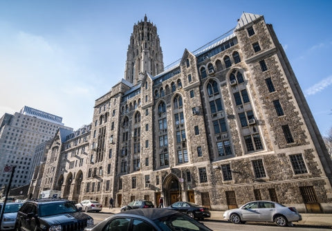 Cathedral of Saint John the Divine exterior building on 122nd Street in Harlem on bright sunny day