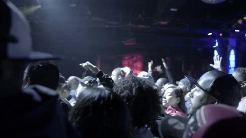 heads bobbing in crowd at hip hop show