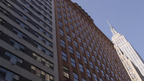 driving view of Empire State Building on 34th Street in Manhattan NYC
