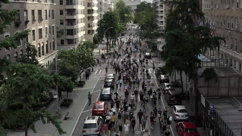 people marching on 5th Ave BLM protest signs New York City NYC