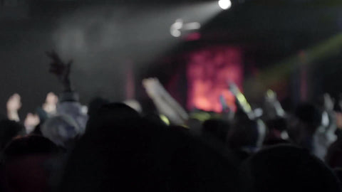 hip hop crowd cheering - fans taking smartphone cam footage and taking pictures - standing in concert - fans watching music show