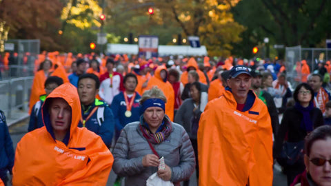 crowd in orange ponchos after Marathon walking out of Central Park 1080 HD in NYC