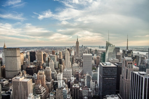 Empire State Building on beautiful day - Manhattan cityscape with skyscrapers from high view