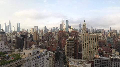 NYC aerial moving forward over buildings in Cooper Square toward Union Square Manhattan New York City