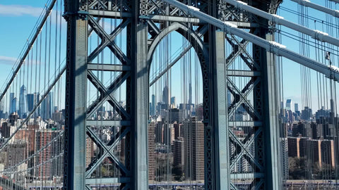 rising up over Manhattan Bridge to Empire State Building cityscape New York City NYC
