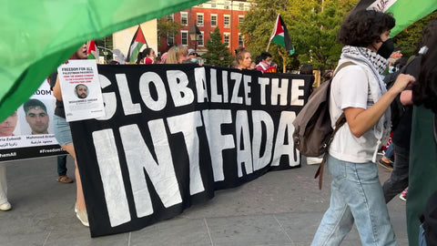 Globalize the Intifada sign at Palestinian rights protest - activists marching in New York City NYC