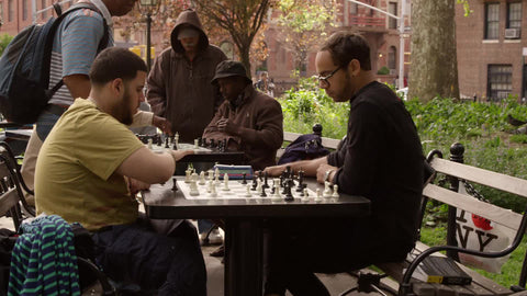 New Yorkers playing chess in Washington Square Park on sunny summer day - slow motion 4K and 1080 HD in NYC